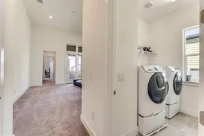 a view of a storage & utility room with washer and dryer