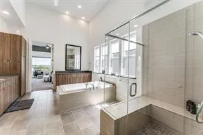 a lobby with a couch and a floor to ceiling window