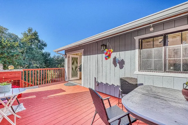 a bedroom with a large bed and a large window