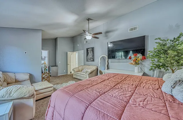 a bathroom with a shower curtain and a bath tub