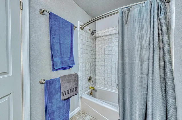 a bedroom with a bed and furniture