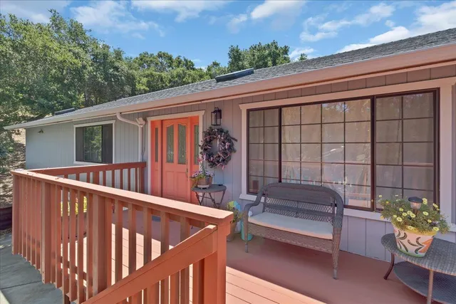 a backyard of a house with a tree