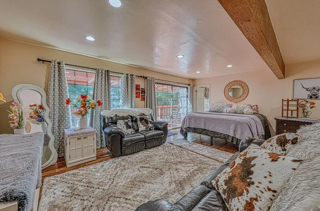a kitchen with granite countertop a refrigerator stove top oven and sink