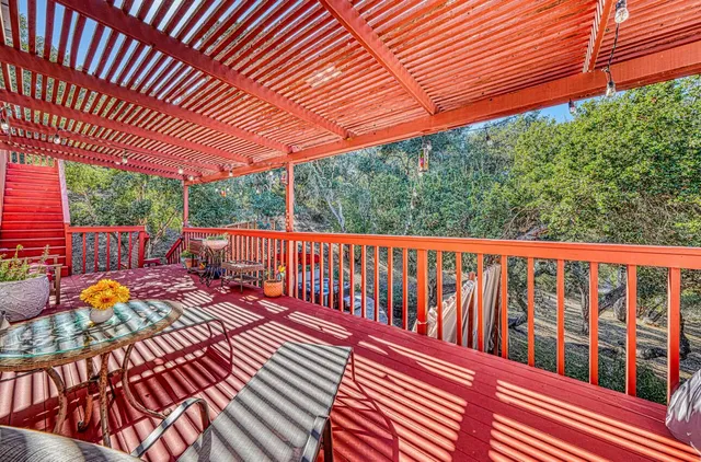 a view of a chairs and tables in the patio