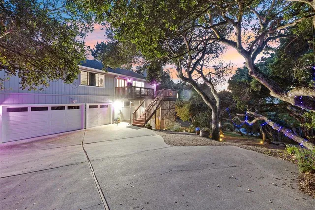 a view of a patio with furniture and a fire pit