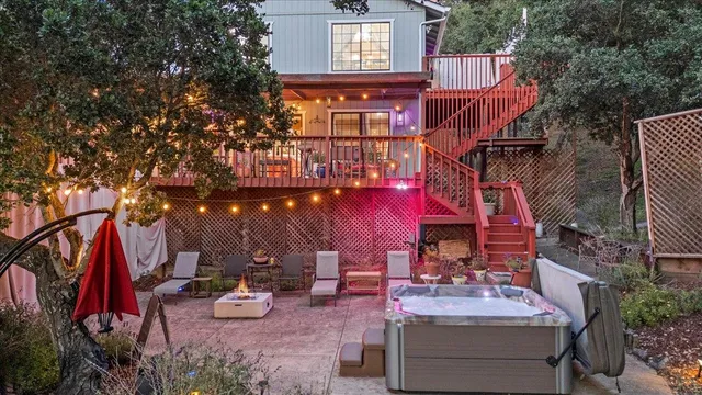 a view of a patio with table and chairs and potted plants