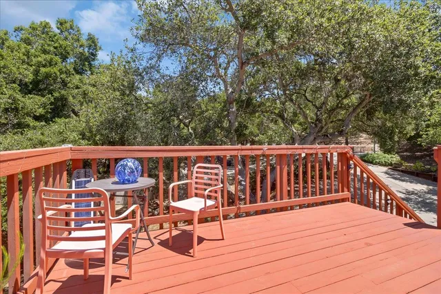 a front view of a house with a potted plant