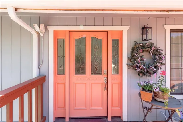 a living room with furniture a fireplace and wooden floor