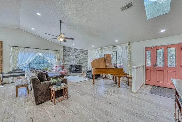 a living room with furniture and a fireplace