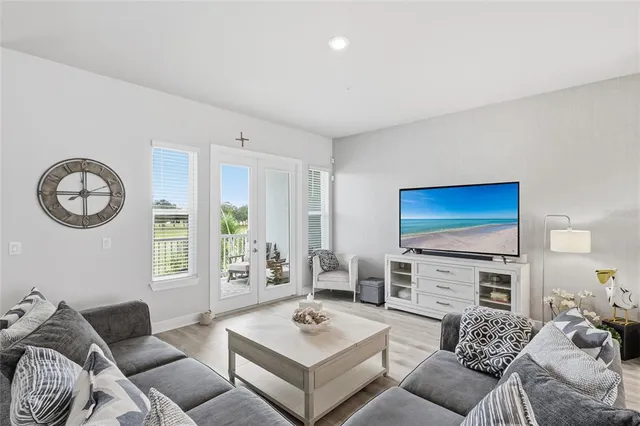 a bed room with furniture and a flat screen tv