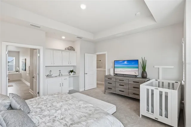 a bathroom with a sink a toilet and shower curtain
