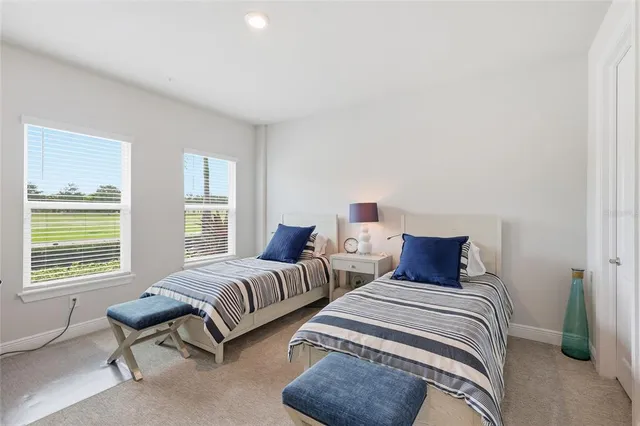 a view of a lake with houses in the back