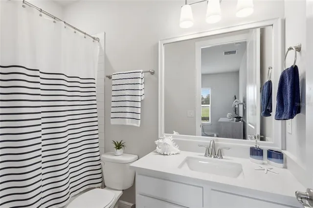 a view of a yard with a table and a chair