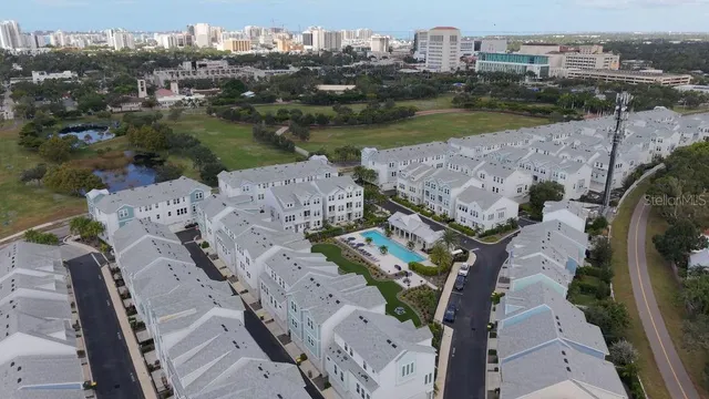 a view of swimming pool with outdoor seating and plants