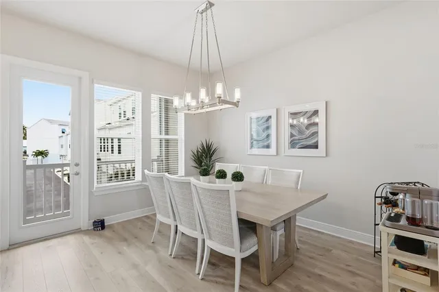 a living room with furniture a table and a large window