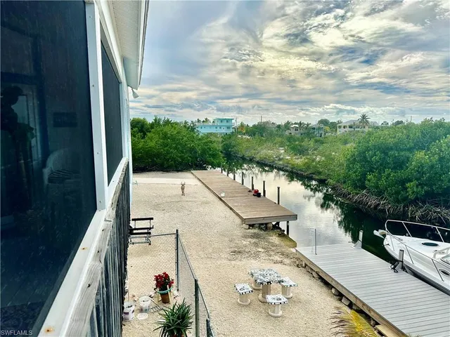 a view of a dinning tables and chairs in the balcony