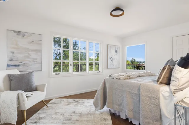 a bedroom with bed and window