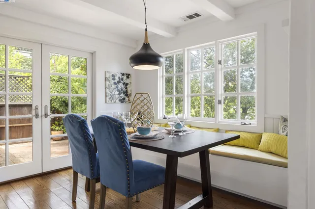 a dining room with furniture window wooden floor