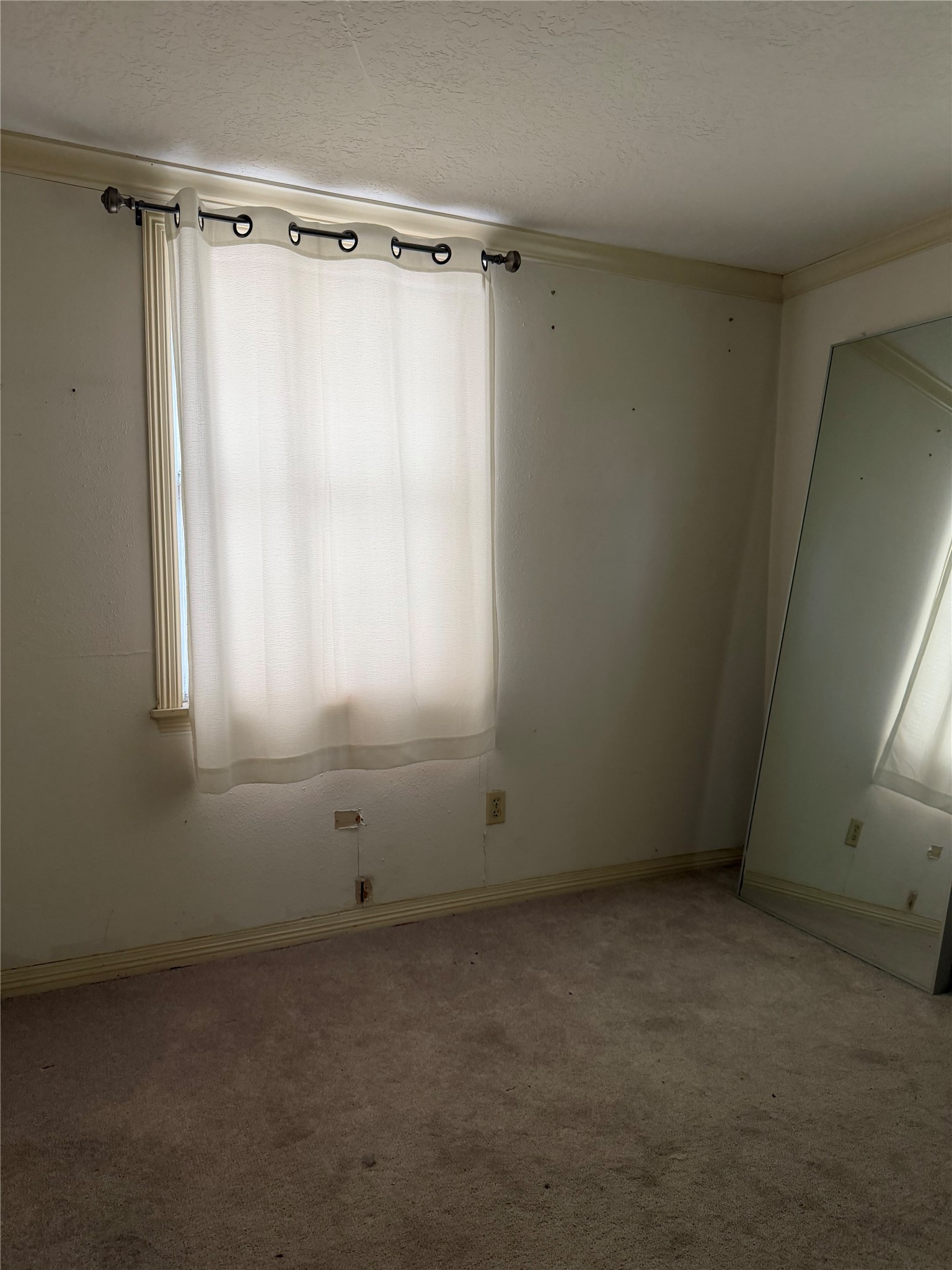 703 76th Street Houston, TX 77012 - Photo 16 of 23 a view of an empty room with a window
