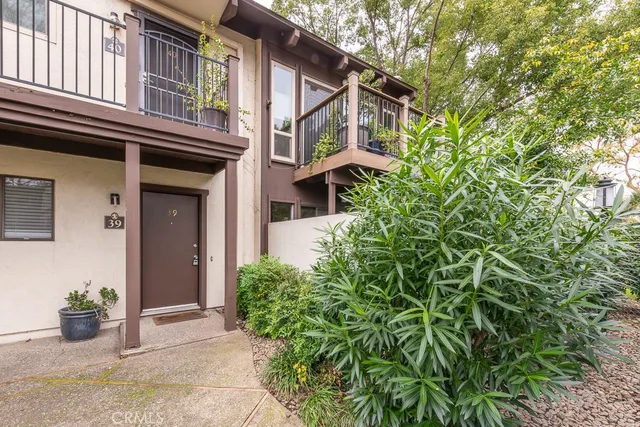 front view of a house with a small yard