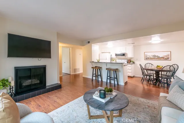 a view of a dining room with furniture and wooden floor
