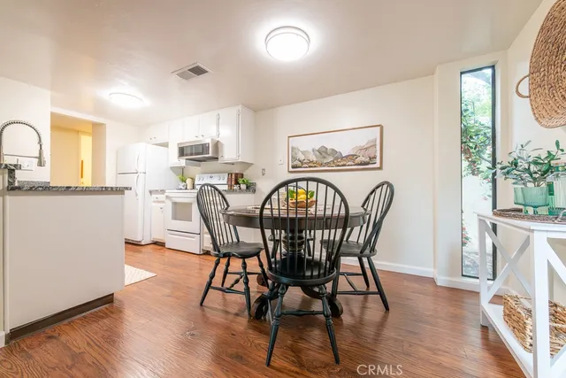 a bedroom with a bed and a table