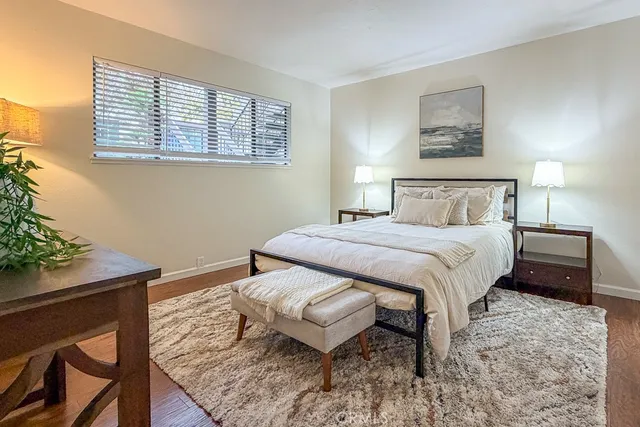 a bedroom with a bed and a table