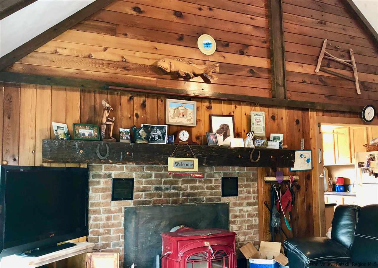 1265 Schuman Road Roxbury, NY 12474 - Photo 3 of 12 a room with lots of different colored cloths