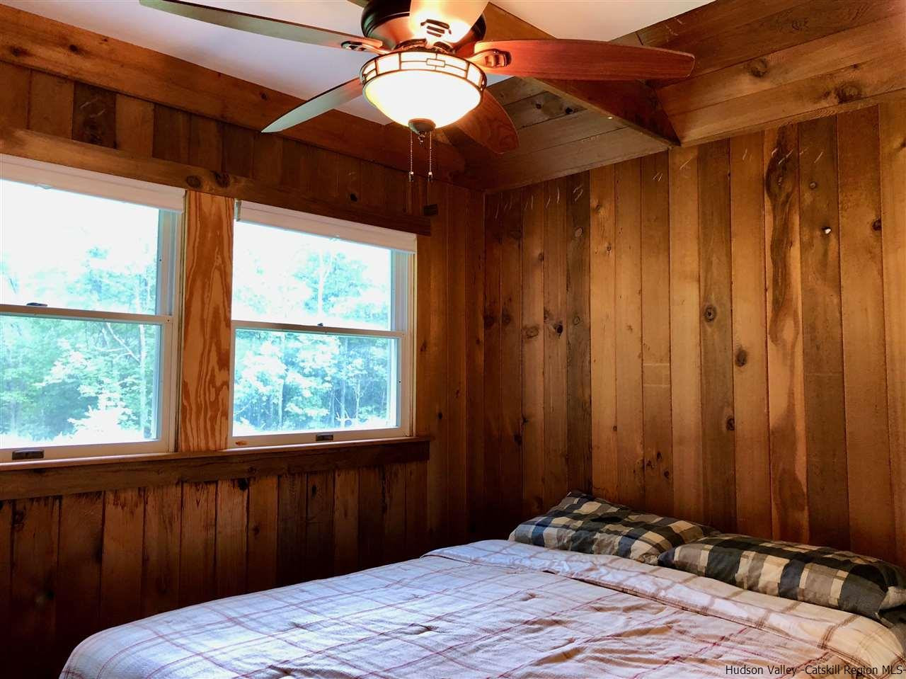 1265 Schuman Road Roxbury, NY 12474 - Photo 6 of 12 a bedroom with a bed and a window