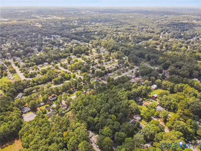 an aerial view of residential houses with city view and mountain view