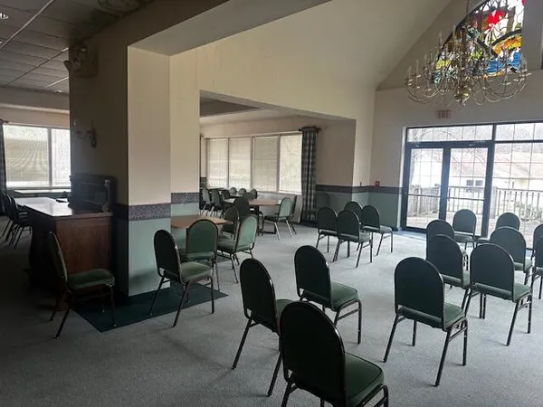 a view of a dining room with furniture and window