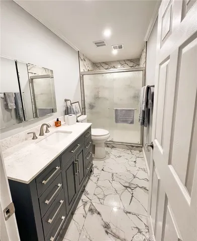 a view of balcony with wooden floor and outdoor seating