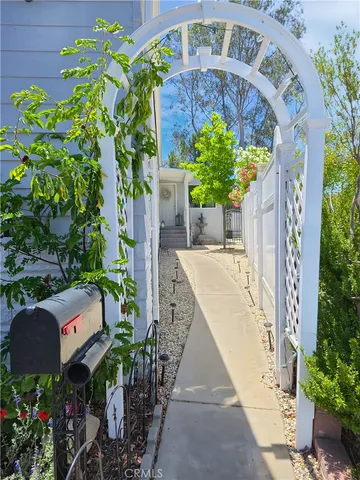 a front view of house with a garden