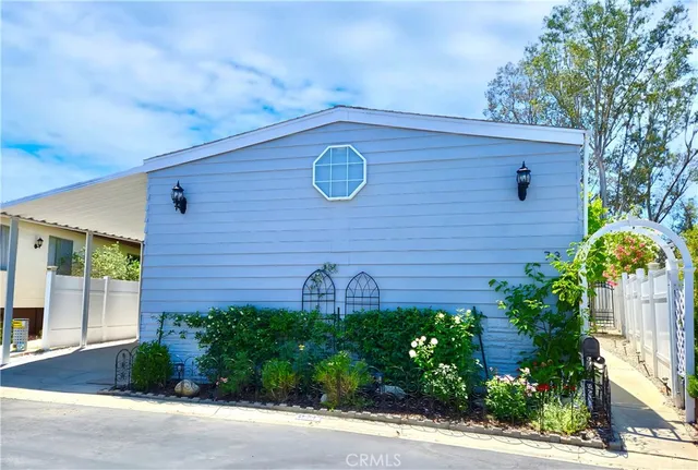 a view of a dining room with furniture wooden floor and chandelier