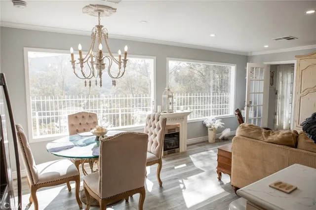 a kitchen with a refrigerator a sink and cabinets