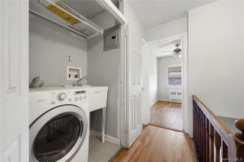 a view of a hallway with washer and dryer