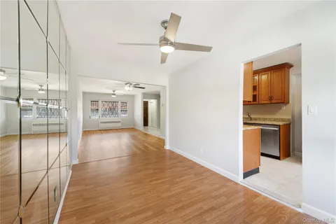 a view of a kitchen with a sink and a refrigerator