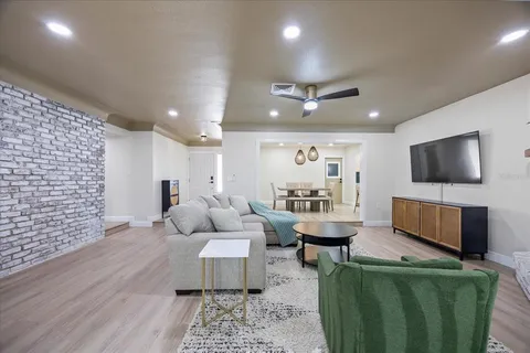 a view of a dining room with furniture and wooden floor