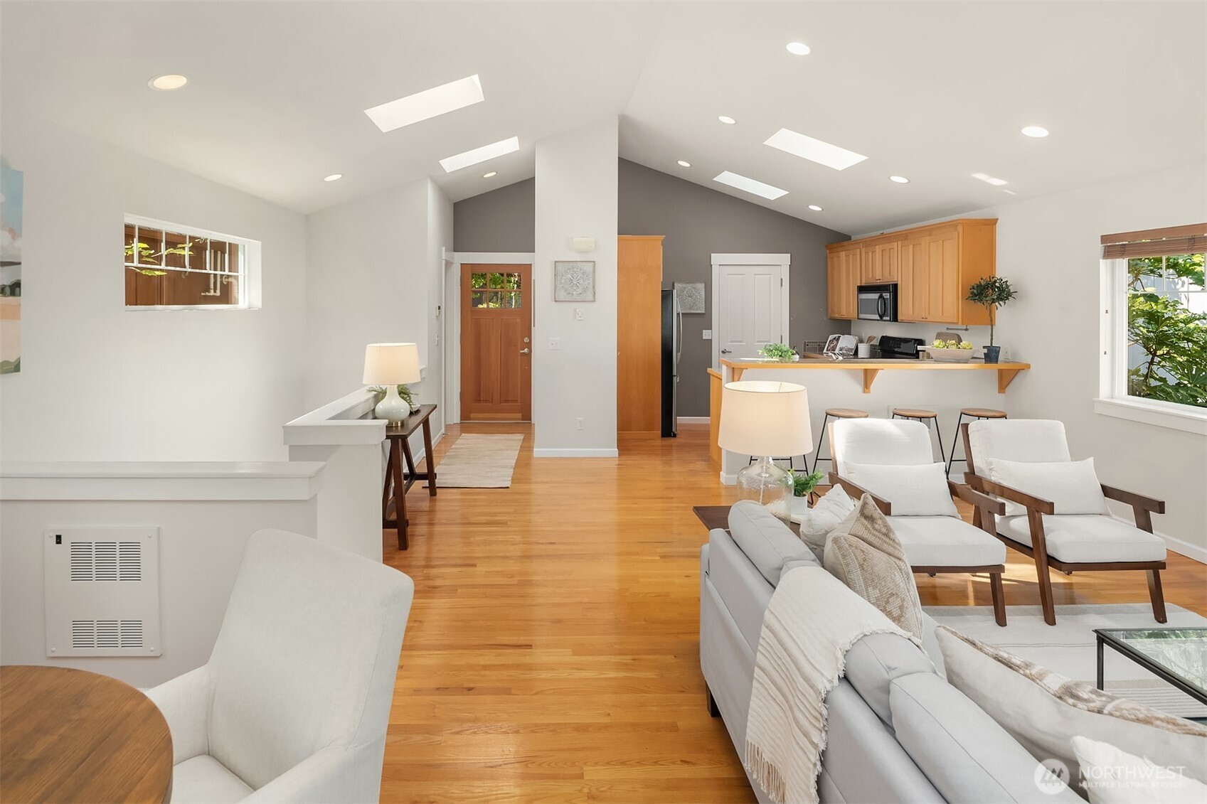 2452 Southwest Webster Street Seattle, WA 98106 - Photo 12 of 28 a living room with furniture and a wooden floor