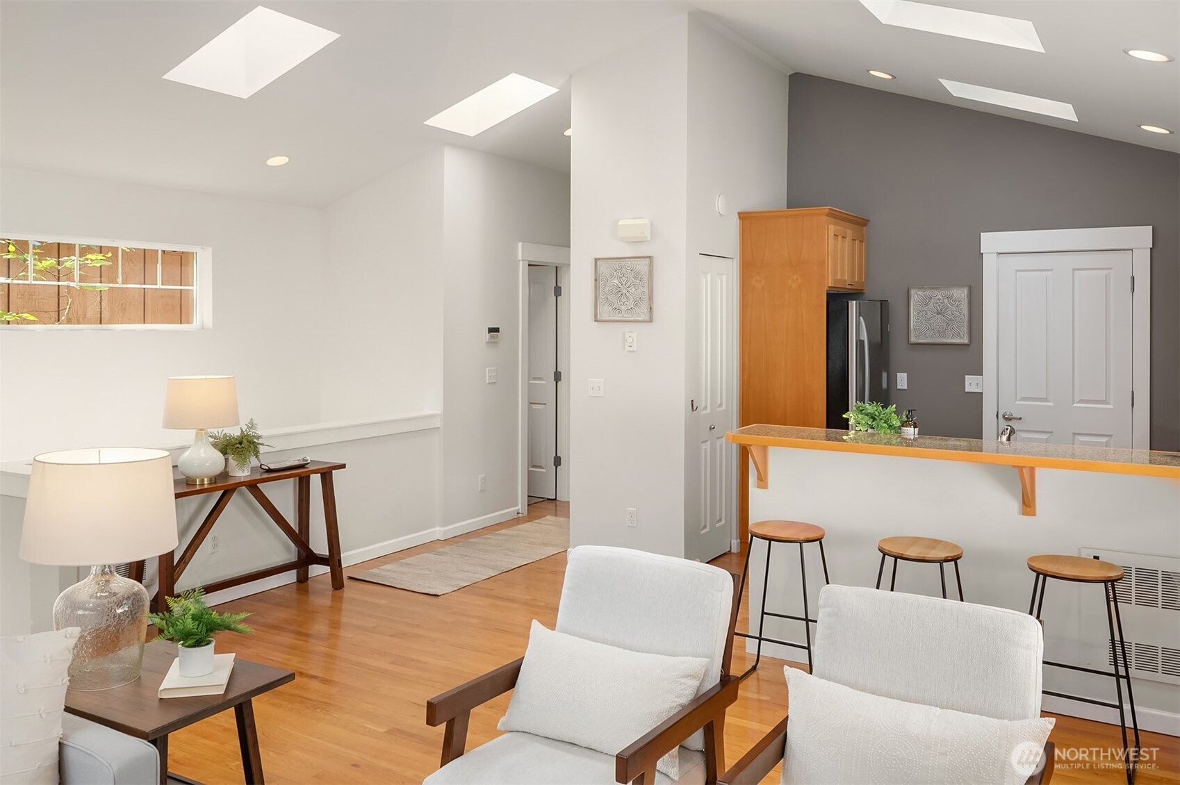 2452 Southwest Webster Street Seattle, WA 98106 - Photo 13 of 28 a living room with furniture and a wooden floor