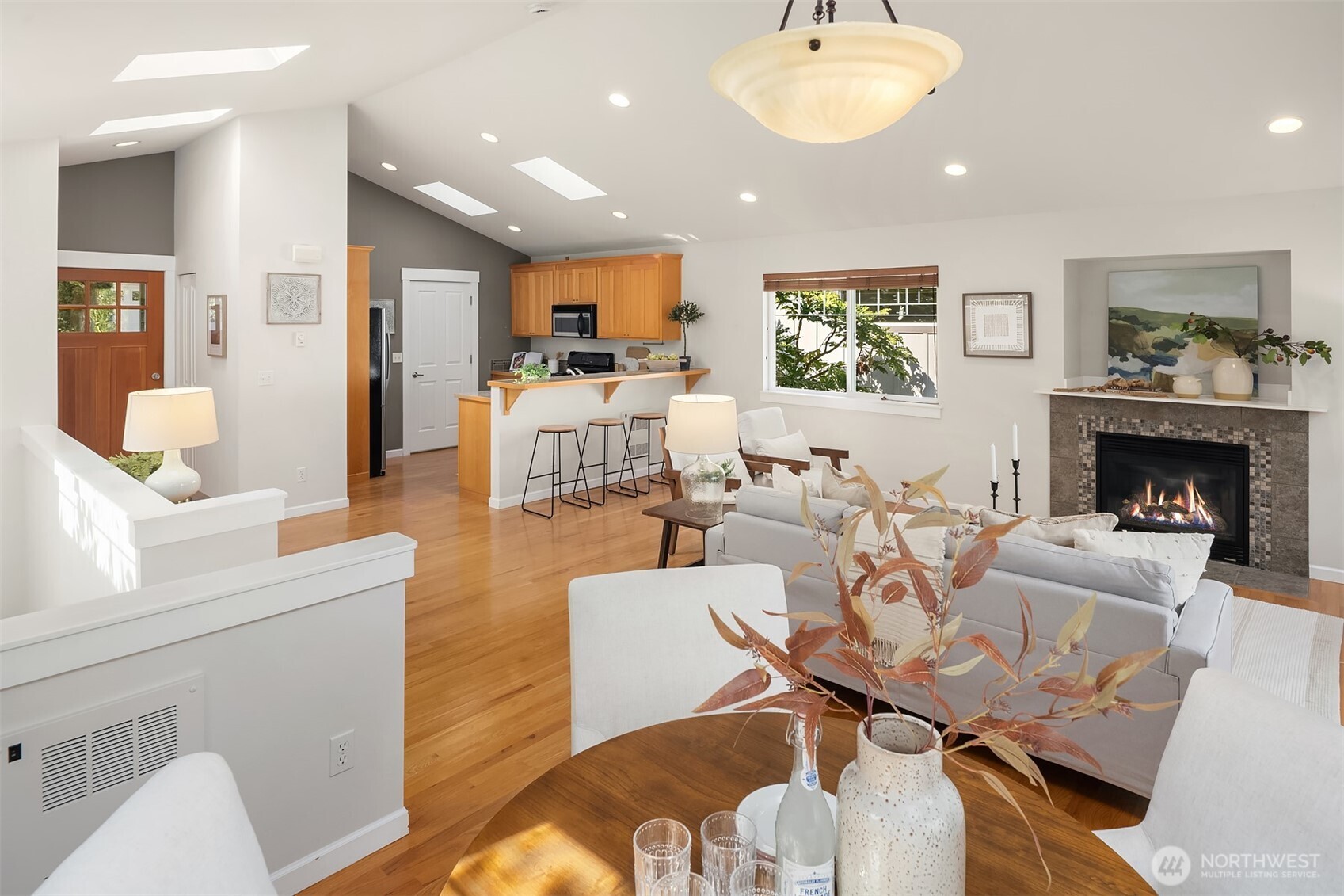 2452 Southwest Webster Street Seattle, WA 98106 - Photo 14 of 28 a living room with fireplace furniture and a wooden floor