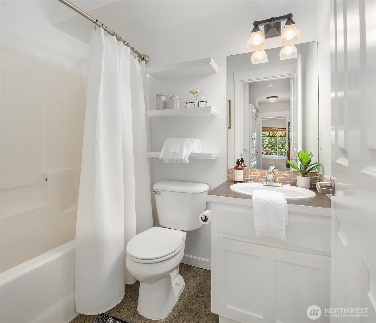 2452 Southwest Webster Street Seattle, WA 98106 - Photo 24 of 28 a bathroom with a sink a toilet and shower