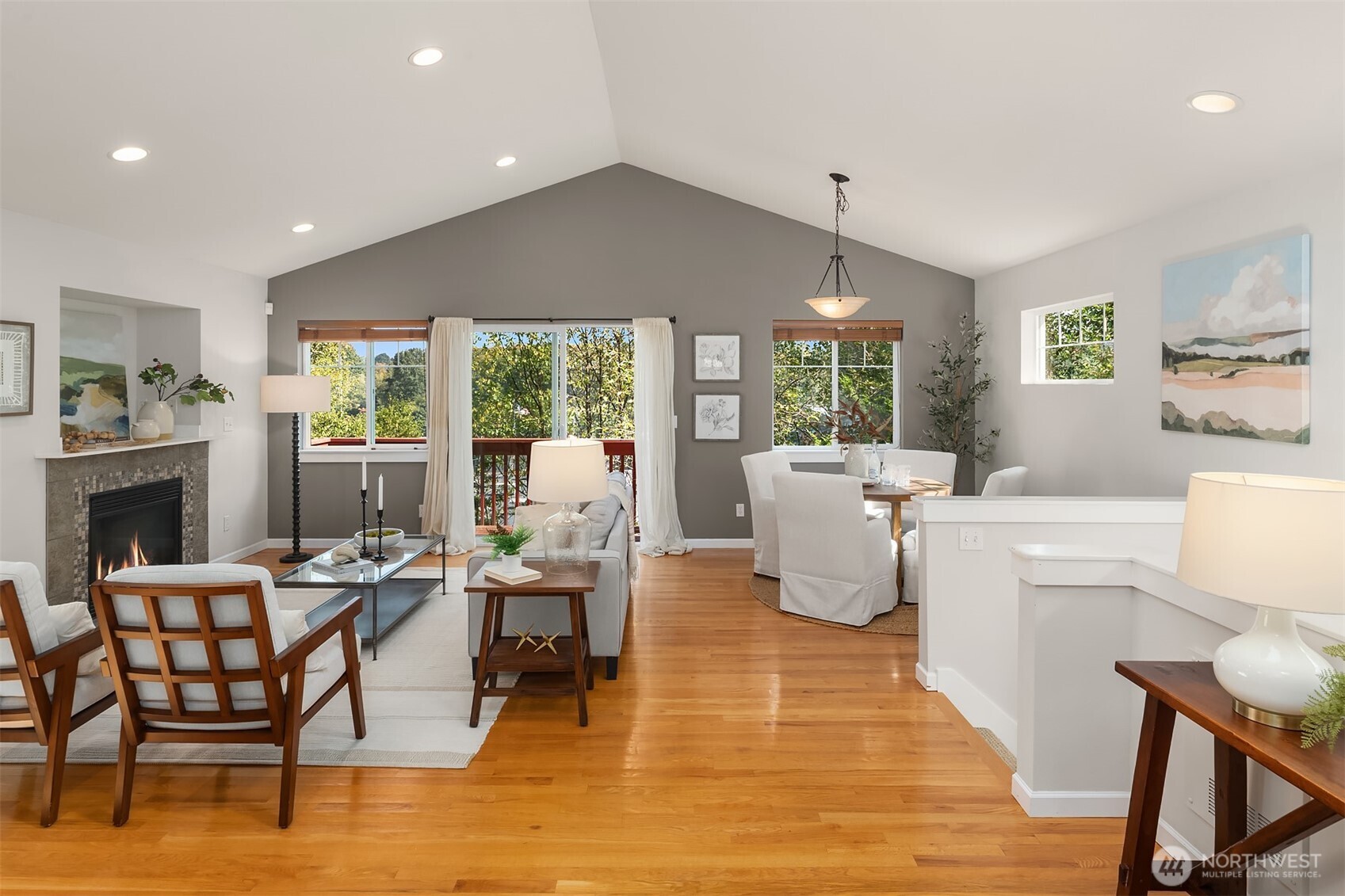 2452 Southwest Webster Street Seattle, WA 98106 - Photo 4 of 28 a living room with fireplace furniture and a wooden floor