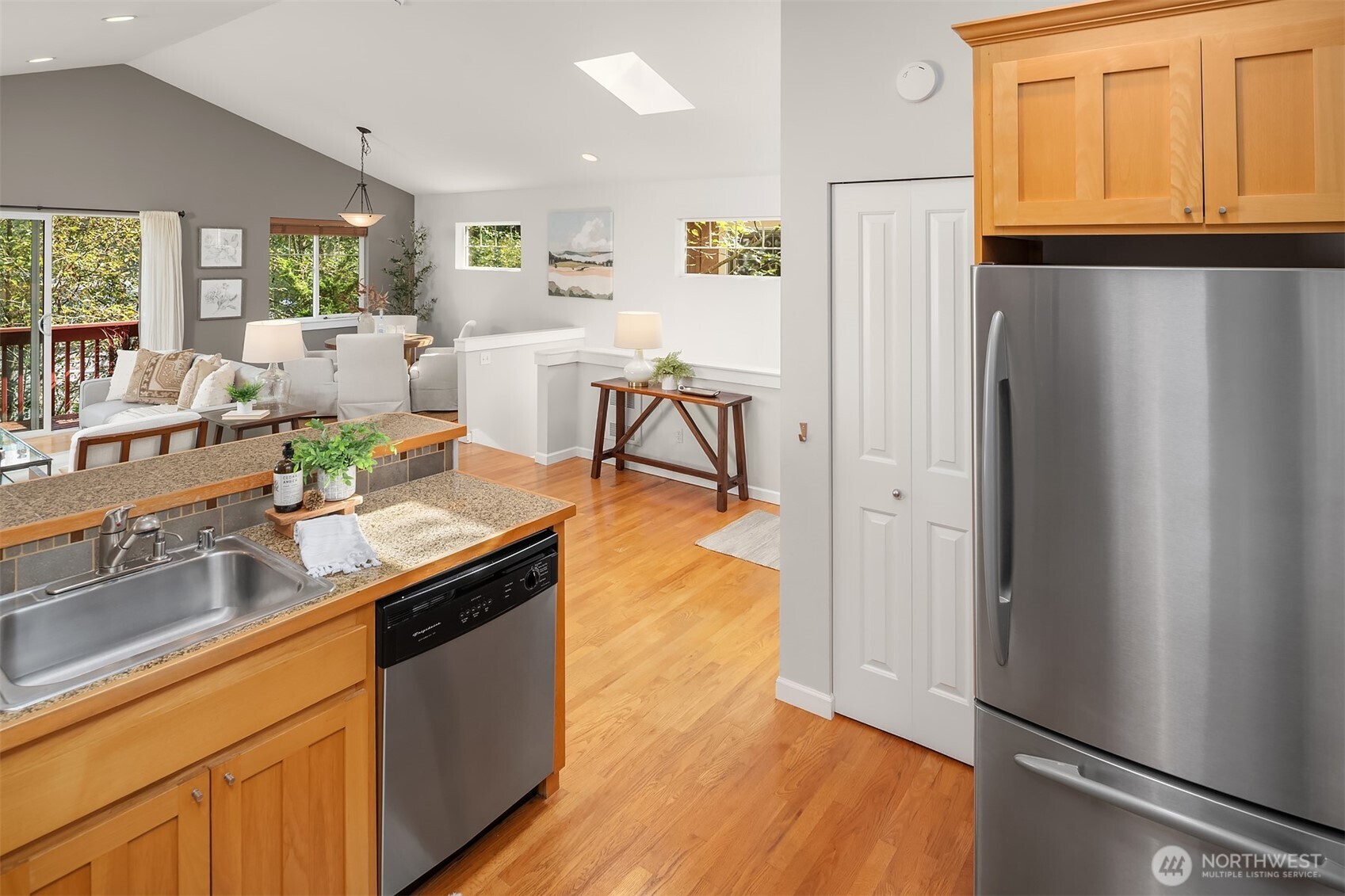 2452 Southwest Webster Street Seattle, WA 98106 - Photo 10 of 28 a kitchen with stainless steel appliances granite countertop a refrigerator and a sink