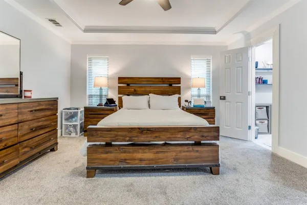 a bedroom with a bed and a cabinets