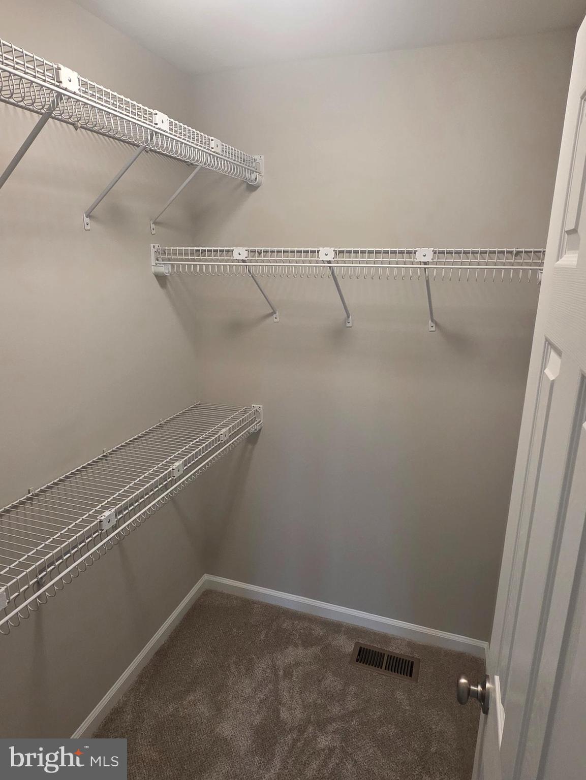 412 Ford Circle Inwood, WV 25428 - Photo 5 of 11 Primary Bedroom walk in closet