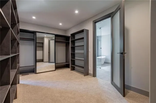 a view of a livingroom with a black and white door