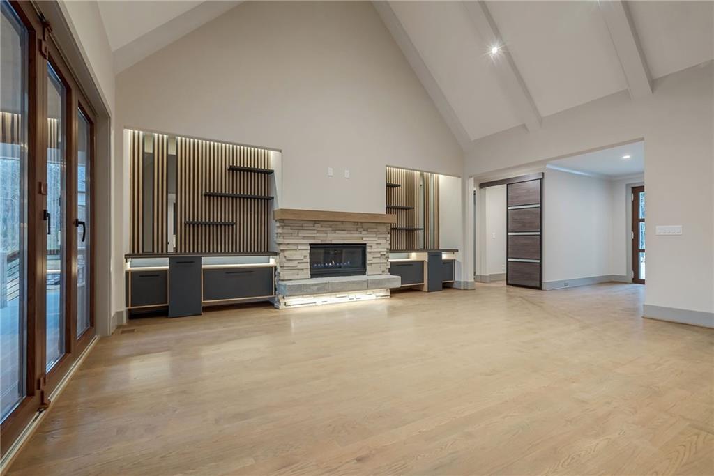 71 Ramey Road Sugar Hill, GA 30518 - Photo 22 of 58 a view of a livingroom with a fireplace cabinet and windows