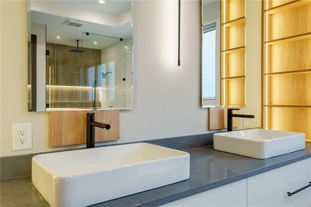 a open kitchen with stainless steel appliances granite countertop a stove and a sink