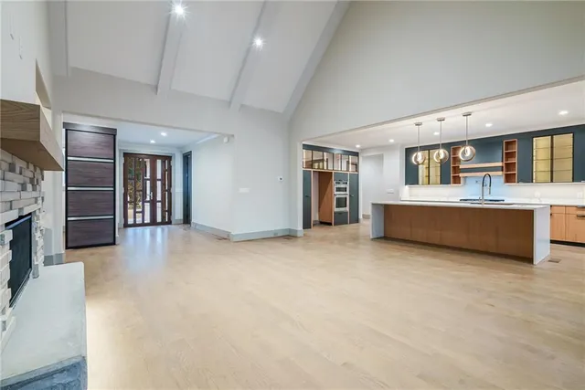 a front view of a house with yard and green space